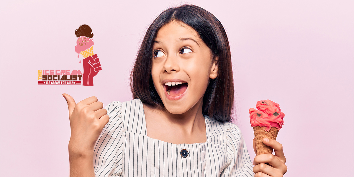 Beautiful child girl holding ice cream pointing thumb up to the side smiling happy with open mouth