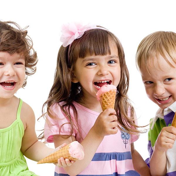 happy children group with ice cream in studio isolated